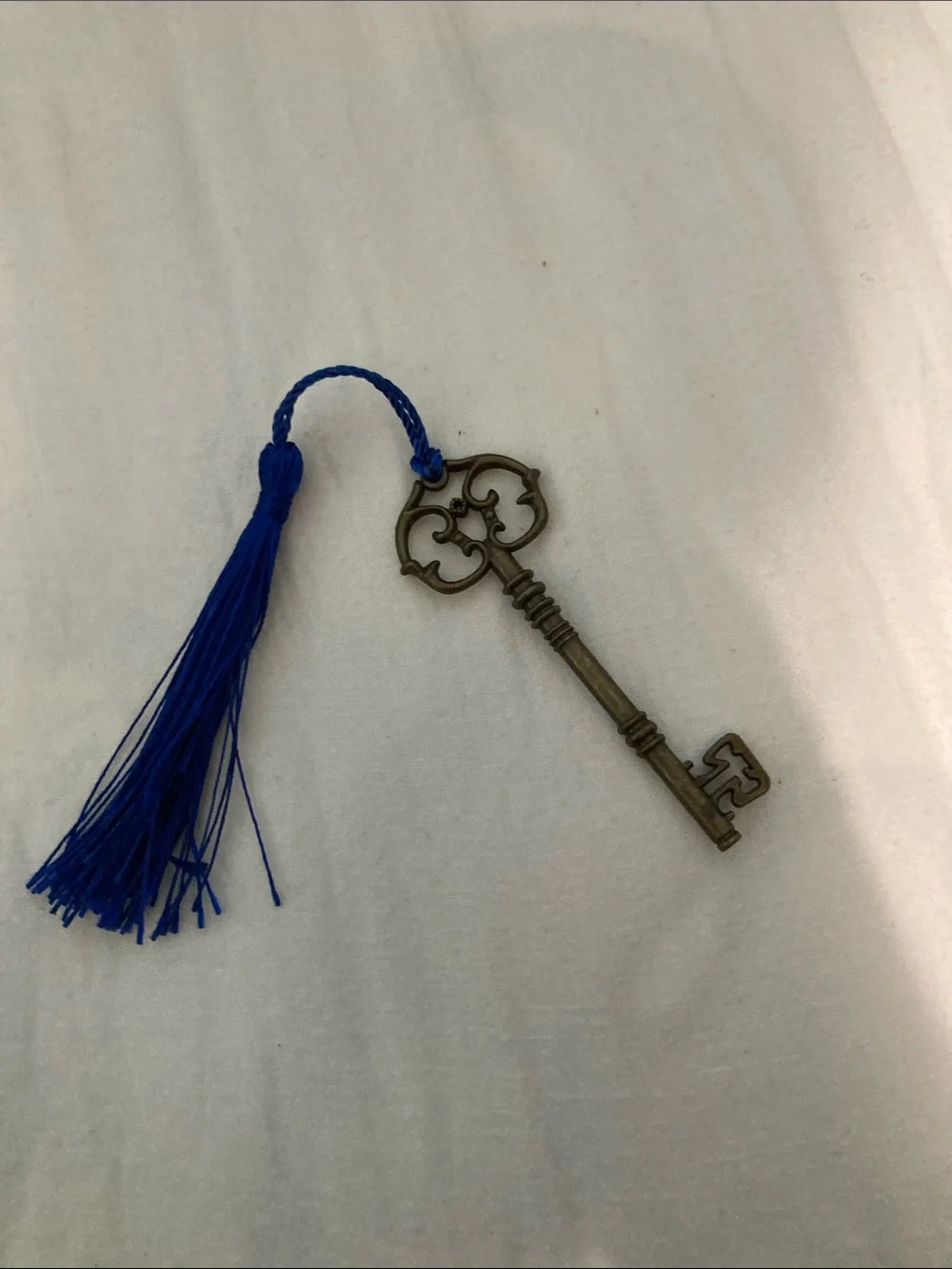 Antique-Style Brass Skeleton Key Wall Decor with Blue Tassel